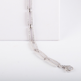 Bracciale fantasia, da donna, in oro bianco 18 kt con incastonate duraliti taglio brillante.